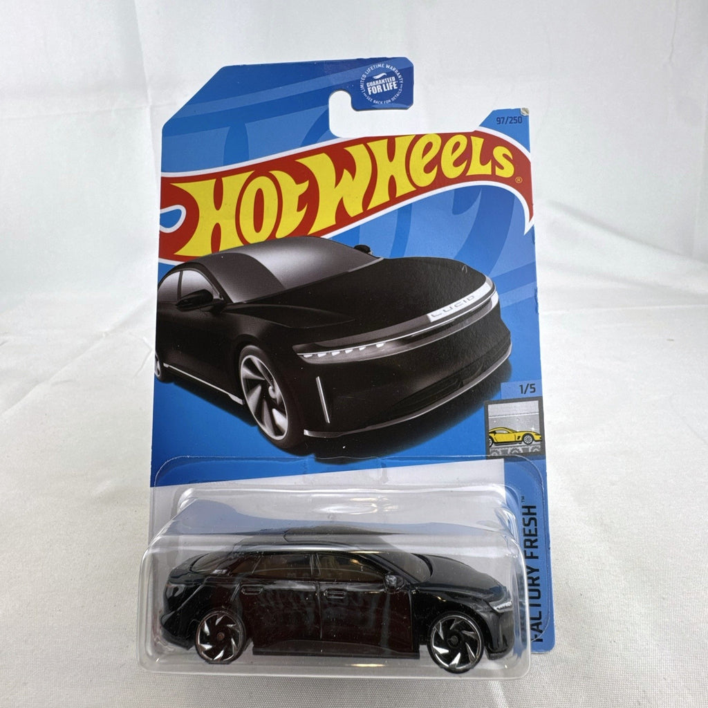 Hot Wheels Factory Fresh 1:64 6-car diecast lot including Nissan Z Proto, Volvo 850 Estate, Land Rover, and Lucid Air.