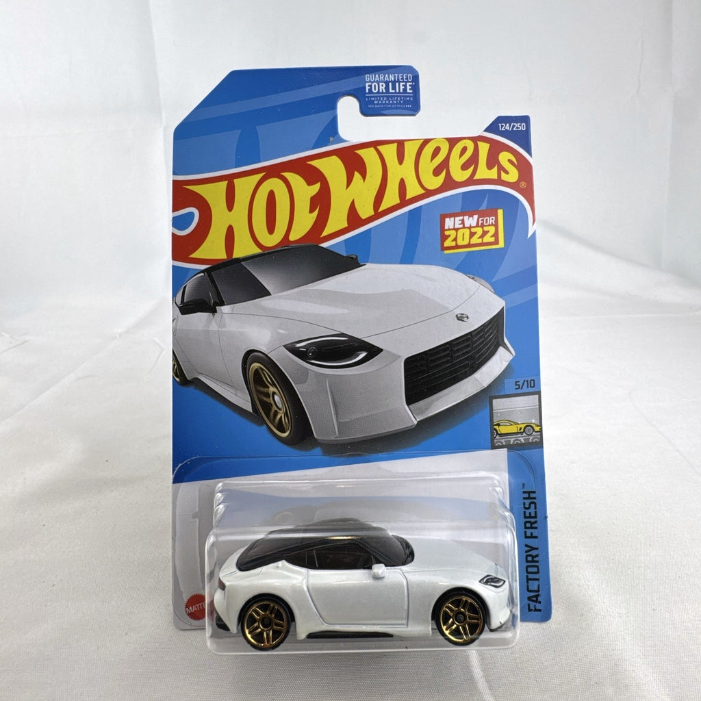 Hot Wheels Factory Fresh 1:64 6-car diecast lot including Nissan Z Proto, Volvo 850 Estate, Land Rover, and Lucid Air.