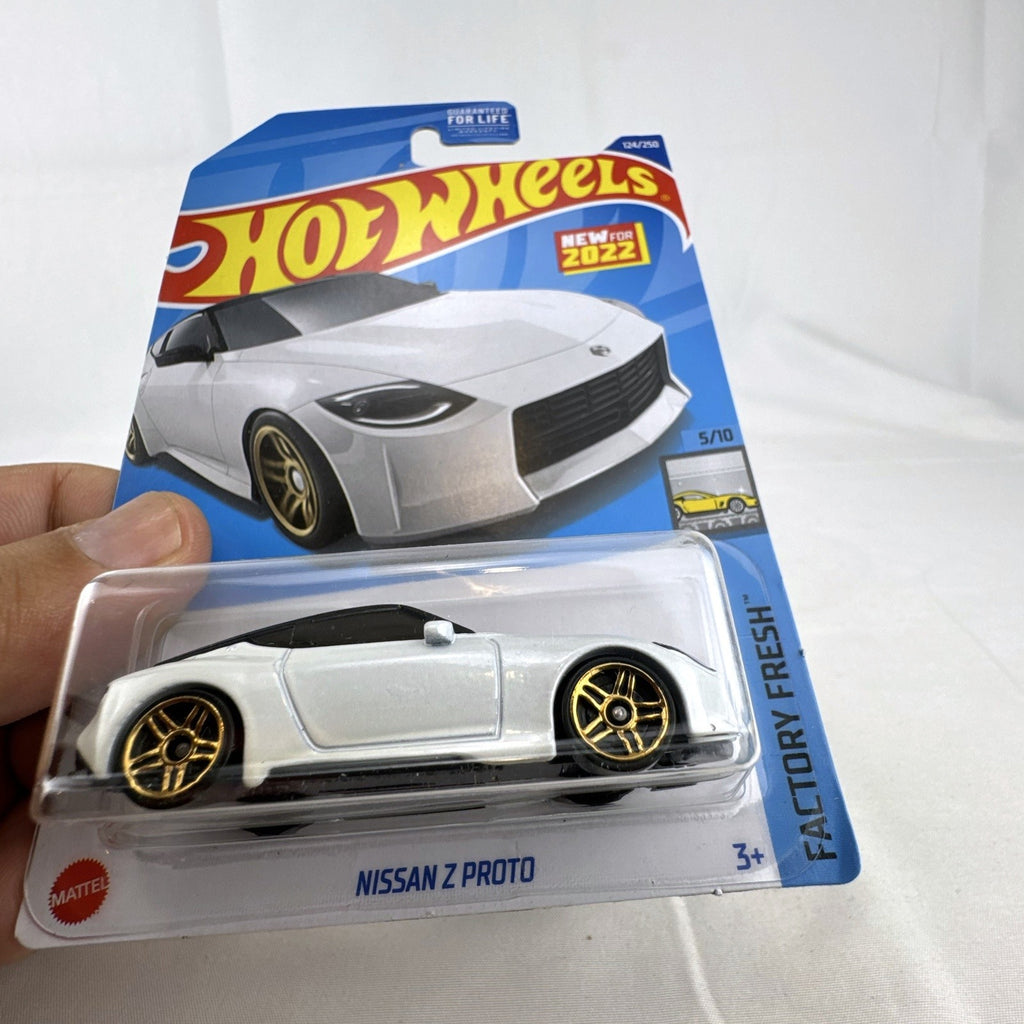 Hot Wheels Factory Fresh 1:64 6-car diecast lot including Nissan Z Proto, Volvo 850 Estate, Land Rover, and Lucid Air.