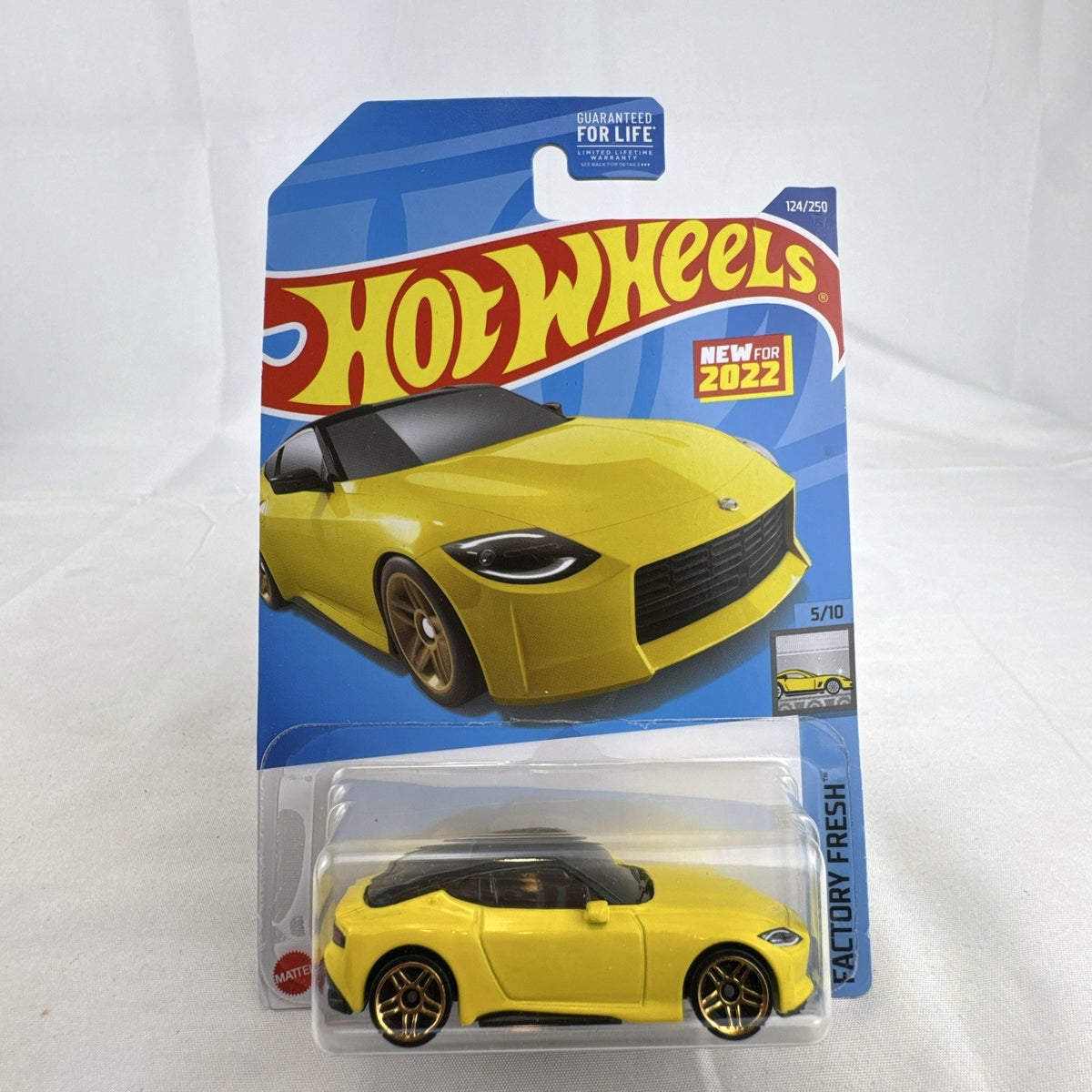 Hot Wheels Factory Fresh 1:64 6-car diecast lot including Nissan Z Proto, Volvo 850 Estate, Land Rover, and Lucid Air.