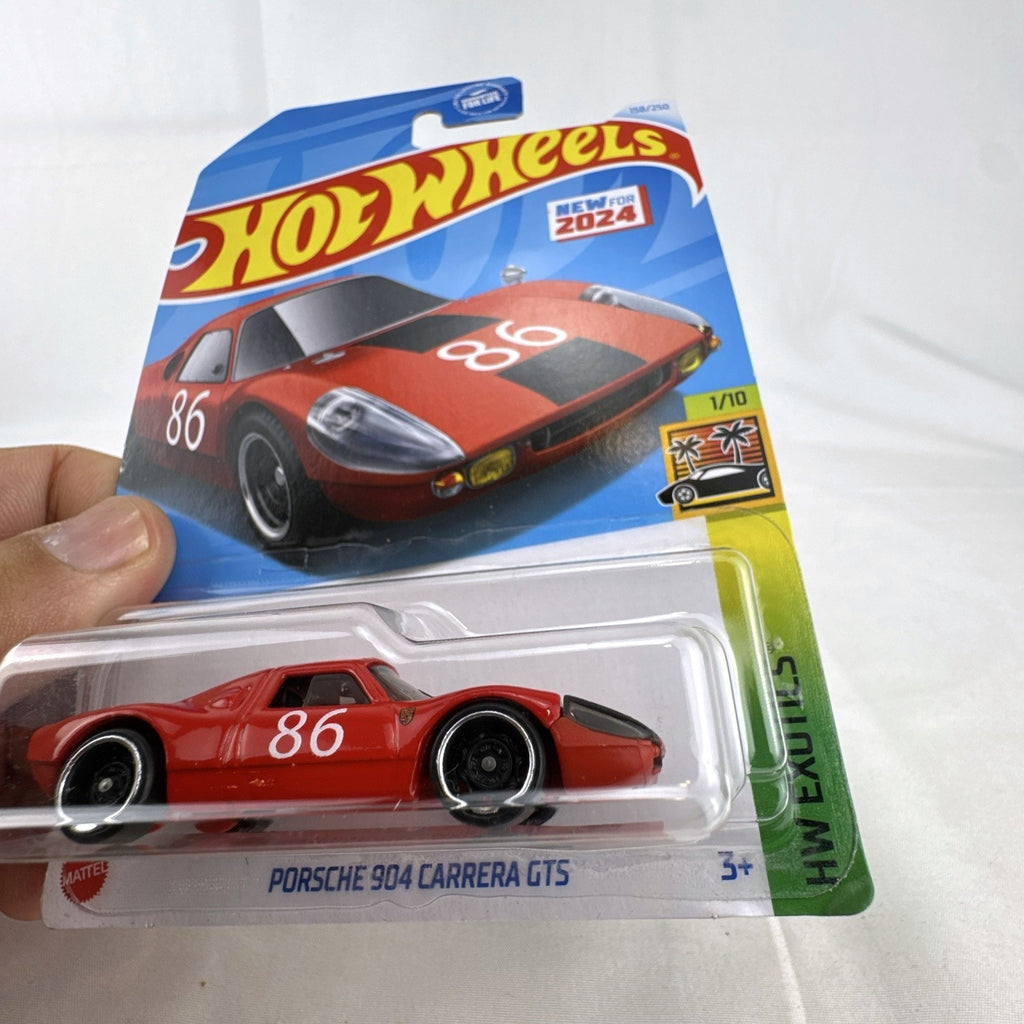 Nine factory sealed Hot Wheels HW Exotics 1:64 scale diecast cars including Porsche, Lamborghini, and Dodge Viper.