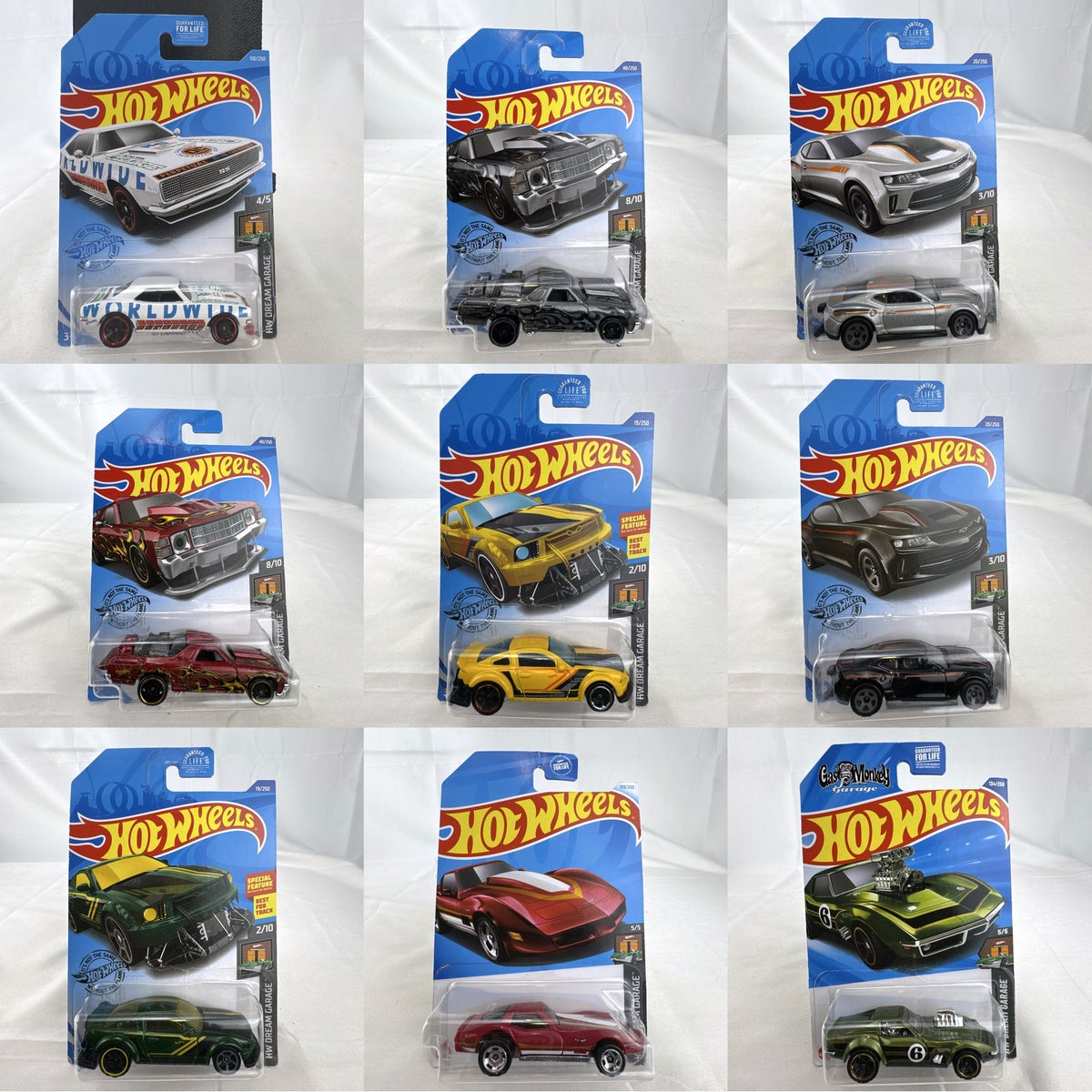 Hot Wheels HW Dream Garage 9-car diecast muscle car lot featuring Chevrolet and Ford models sealed on card.