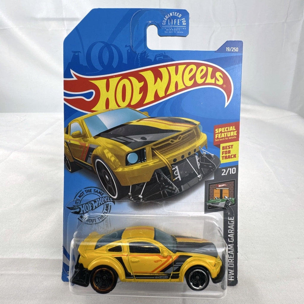 Hot Wheels HW Dream Garage 9-car diecast muscle car lot featuring Chevrolet and Ford models sealed on card.