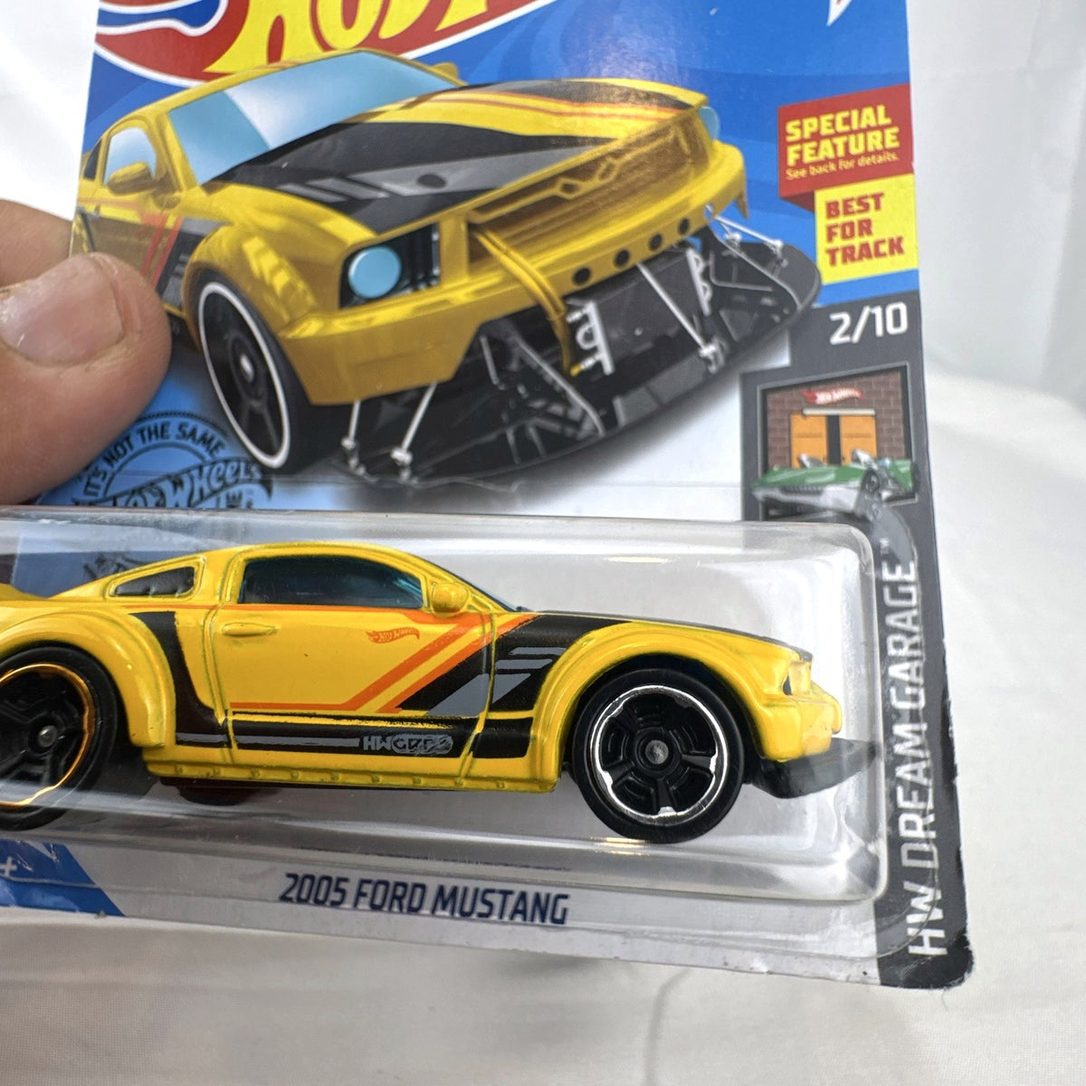 Hot Wheels HW Dream Garage 9-car diecast muscle car lot featuring Chevrolet and Ford models sealed on card.