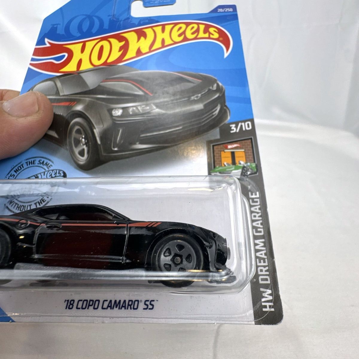 Hot Wheels HW Dream Garage 9-car diecast muscle car lot featuring Chevrolet and Ford models sealed on card.