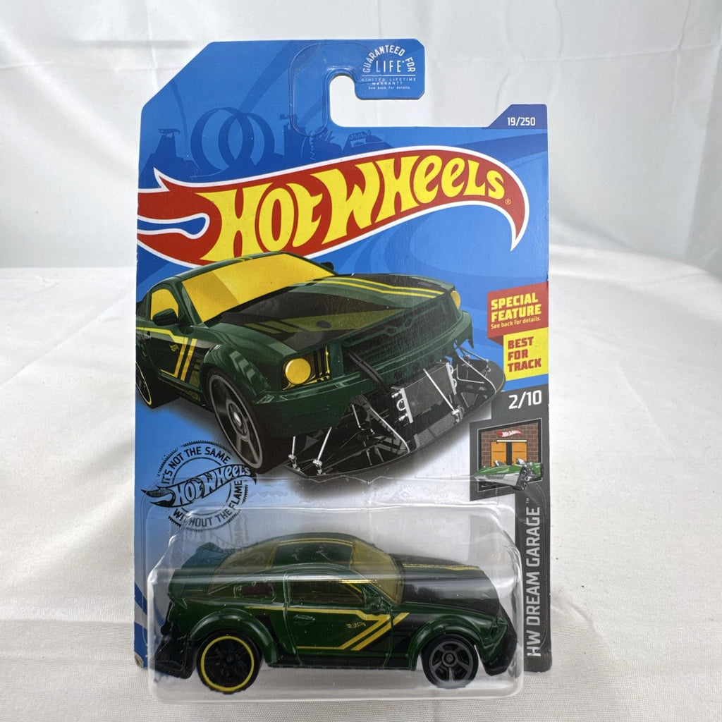 Hot Wheels HW Dream Garage 9-car diecast muscle car lot featuring Chevrolet and Ford models sealed on card.