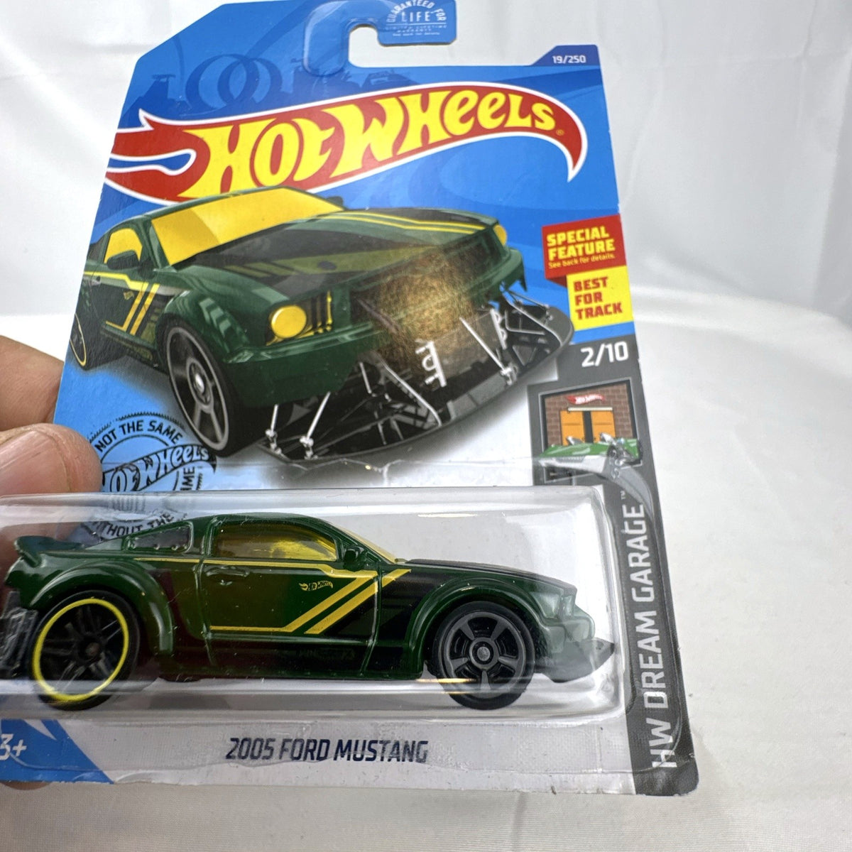 Hot Wheels HW Dream Garage 9-car diecast muscle car lot featuring Chevrolet and Ford models sealed on card.