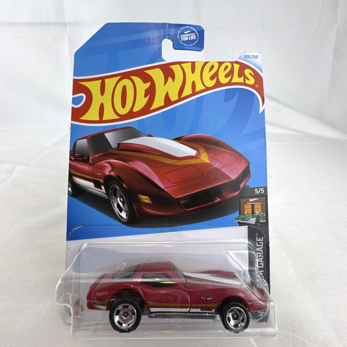 Hot Wheels HW Dream Garage 9-car diecast muscle car lot featuring Chevrolet and Ford models sealed on card.