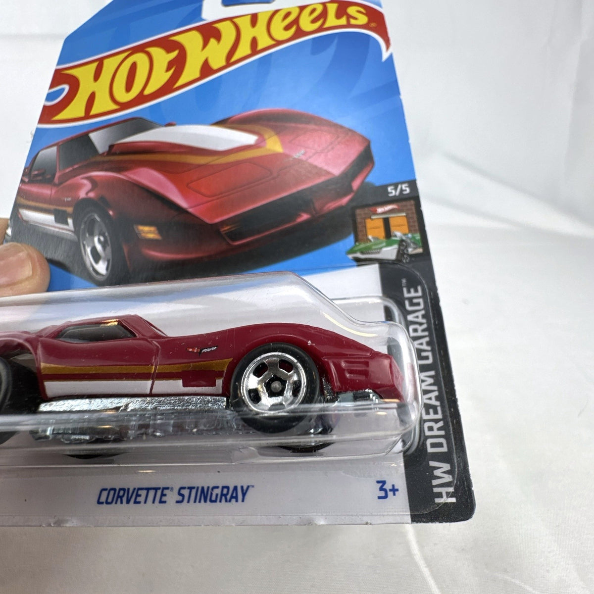 Hot Wheels HW Dream Garage 9-car diecast muscle car lot featuring Chevrolet and Ford models sealed on card.