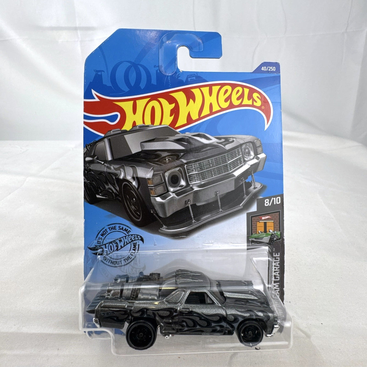 Hot Wheels HW Dream Garage 9-car diecast muscle car lot featuring Chevrolet and Ford models sealed on card.