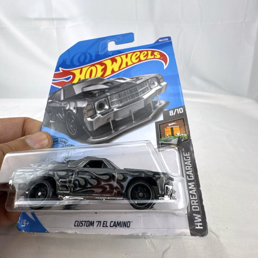 Hot Wheels HW Dream Garage 9-car diecast muscle car lot featuring Chevrolet and Ford models sealed on card.