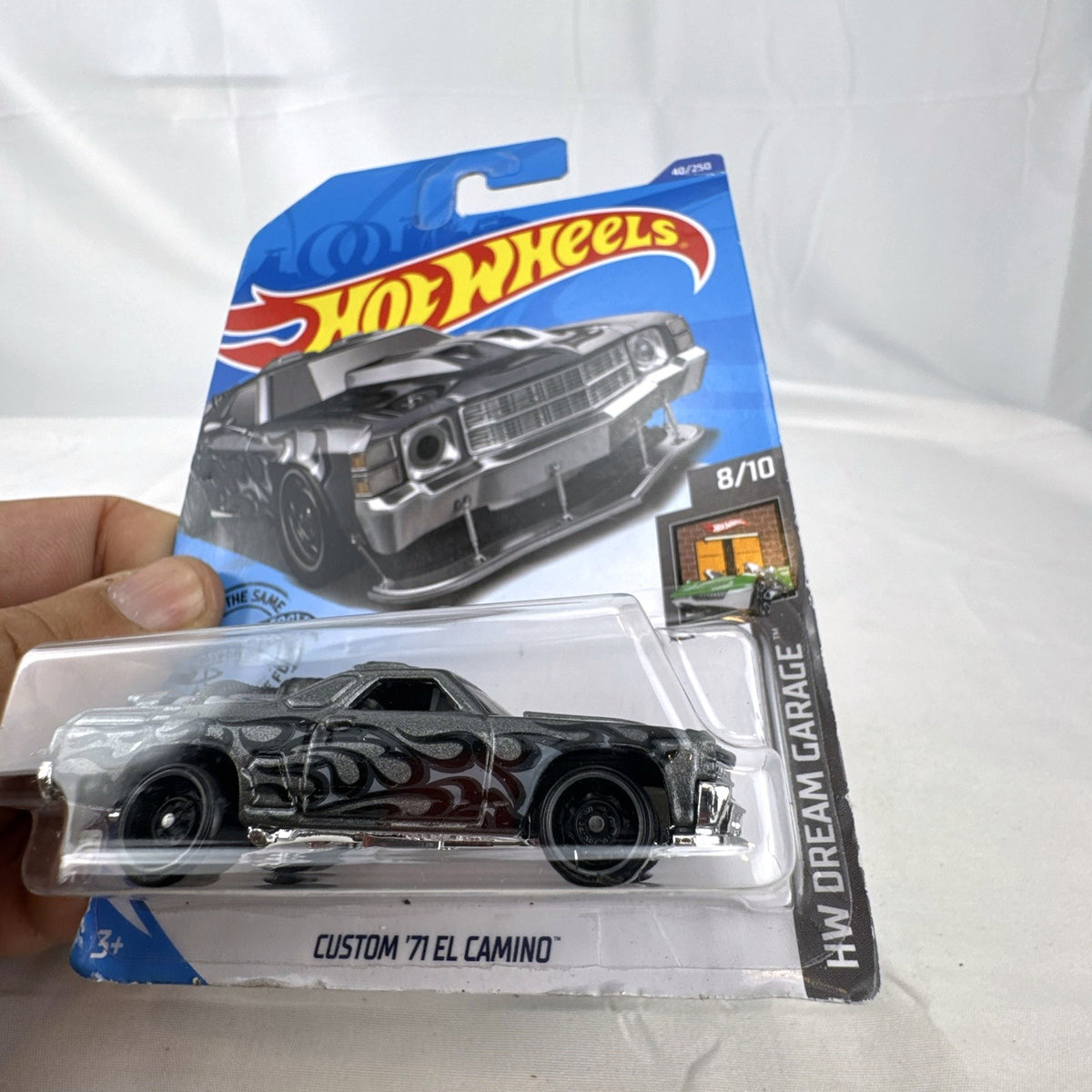 Hot Wheels HW Dream Garage 9-car diecast muscle car lot featuring Chevrolet and Ford models sealed on card.