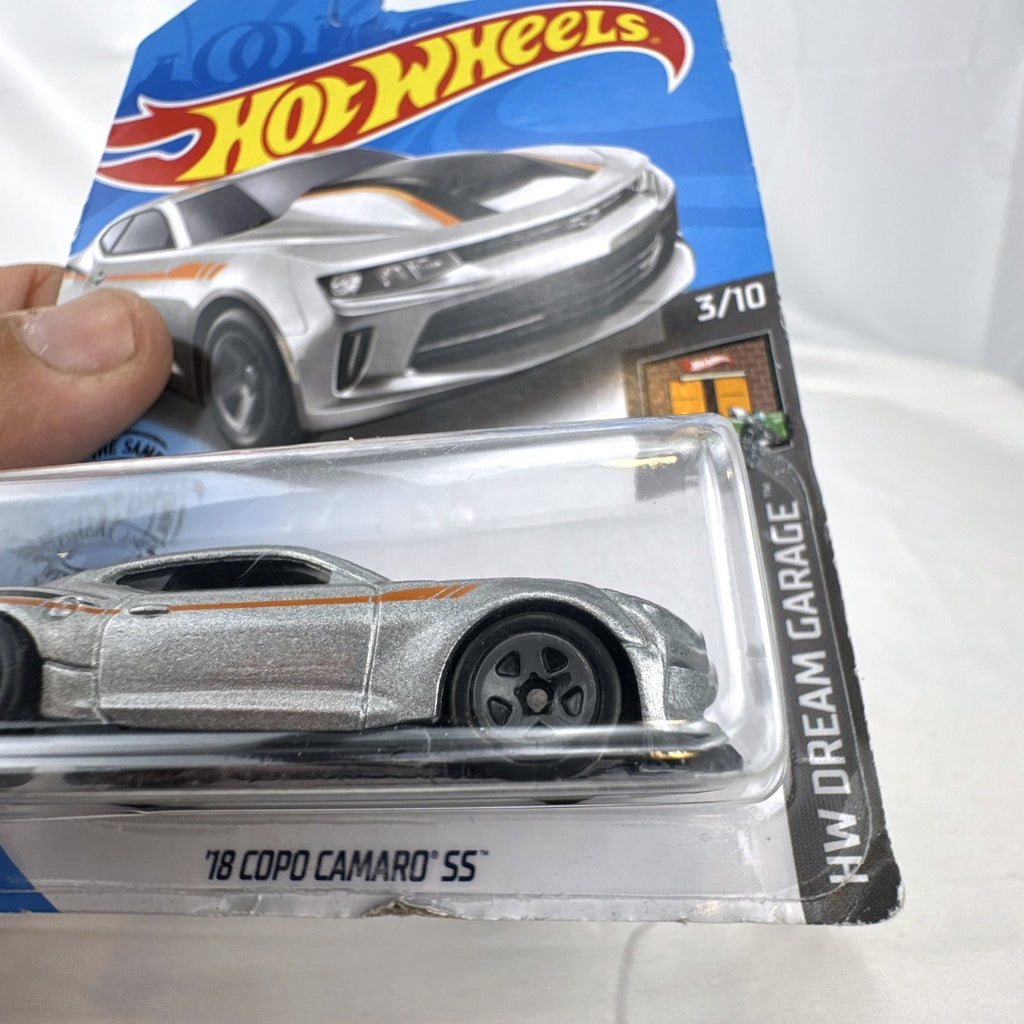 Hot Wheels HW Dream Garage 9-car diecast muscle car lot featuring Chevrolet and Ford models sealed on card.
