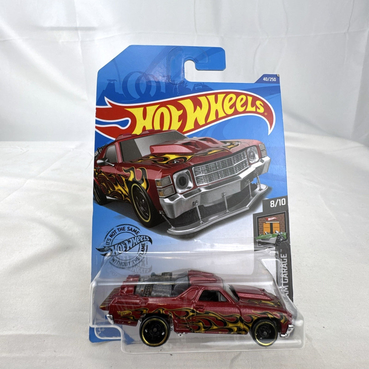 Hot Wheels HW Dream Garage 9-car diecast muscle car lot featuring Chevrolet and Ford models sealed on card.
