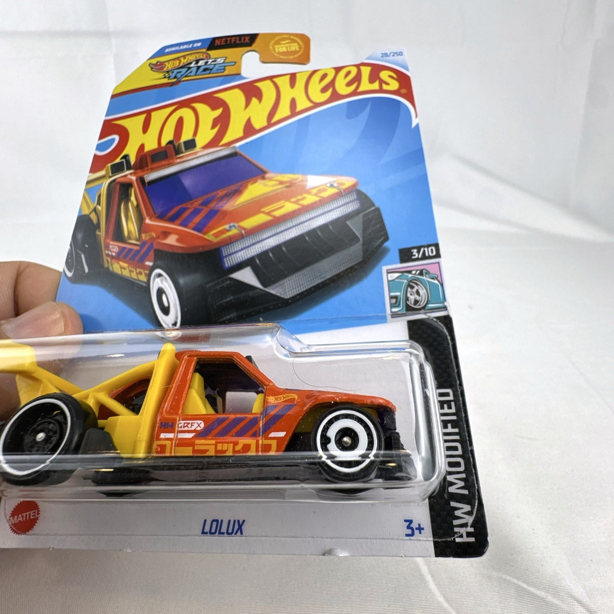 Hot Wheels HW Modified series 1:64 scale diecast 8-car lot featuring custom tuner trucks and widebody muscle cars
