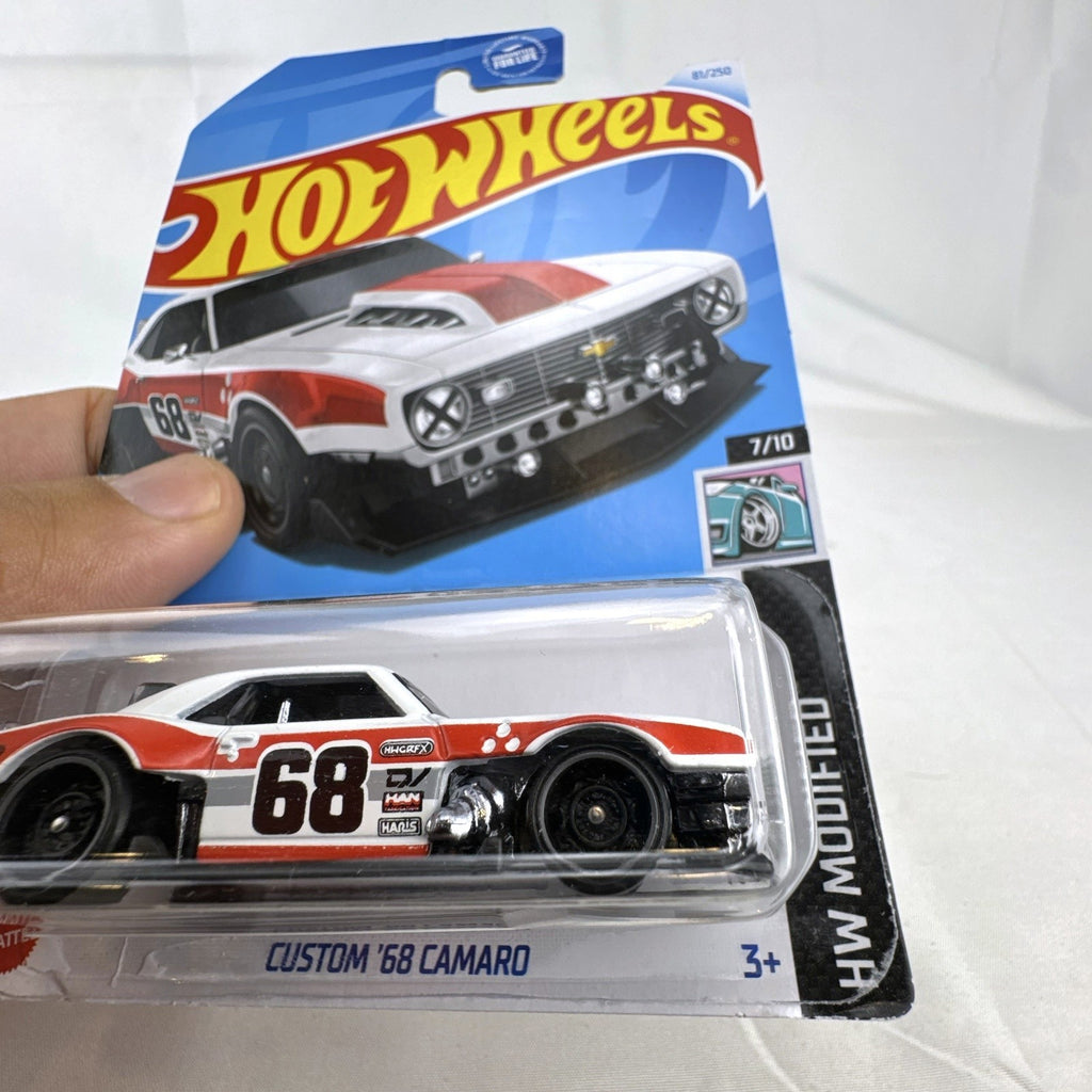Hot Wheels HW Modified series 1:64 scale diecast 8-car lot featuring custom tuner trucks and widebody muscle cars