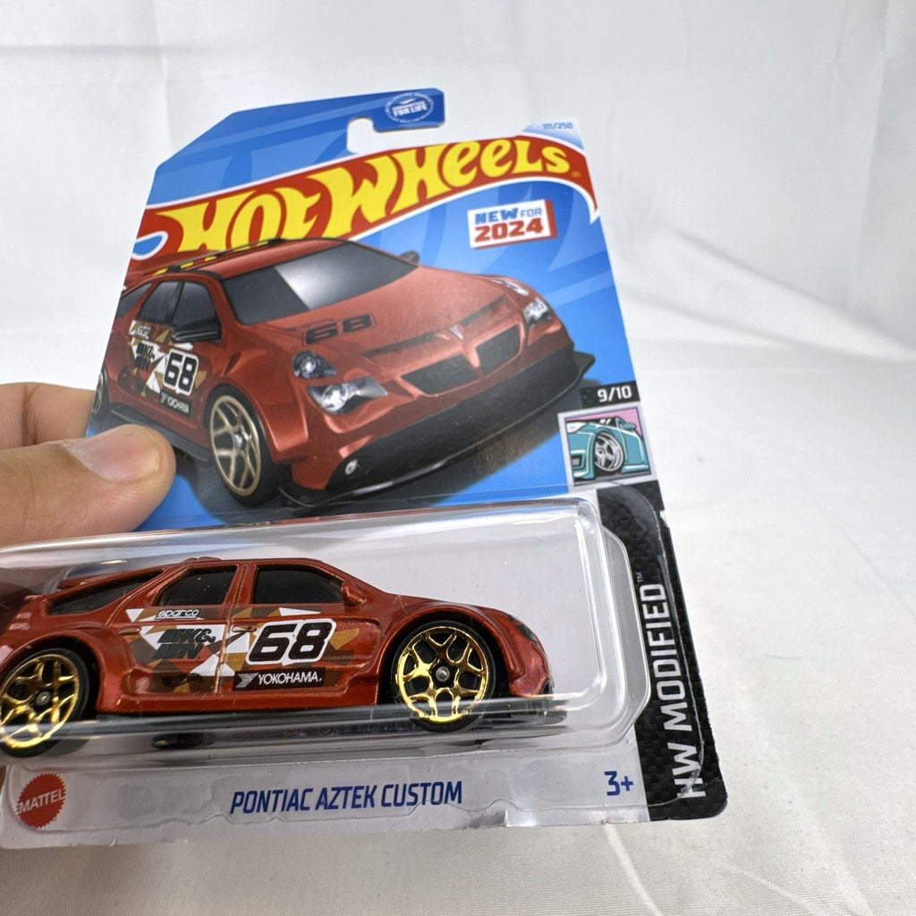Hot Wheels HW Modified series 1:64 scale diecast 8-car lot featuring custom tuner trucks and widebody muscle cars