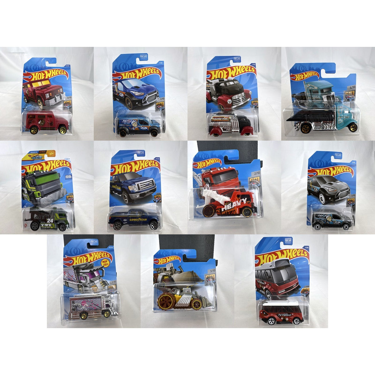 Hot Wheels HW Metro 11-car diecast set featuring 1:64 scale commercial and utility vehicles sealed on original cards.