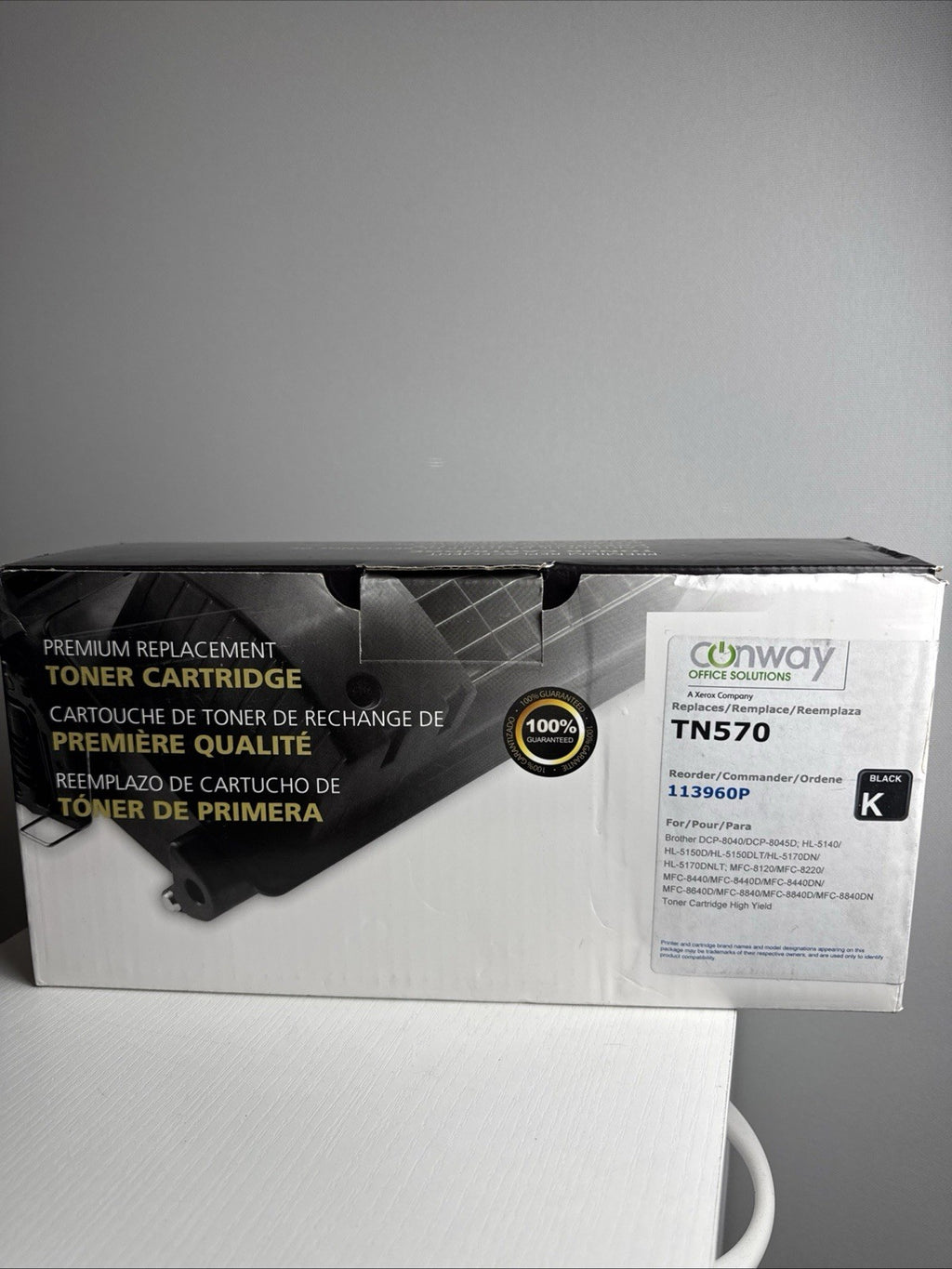 Generic replacement TN-570 black laser toner cartridge sealed in protective packaging.