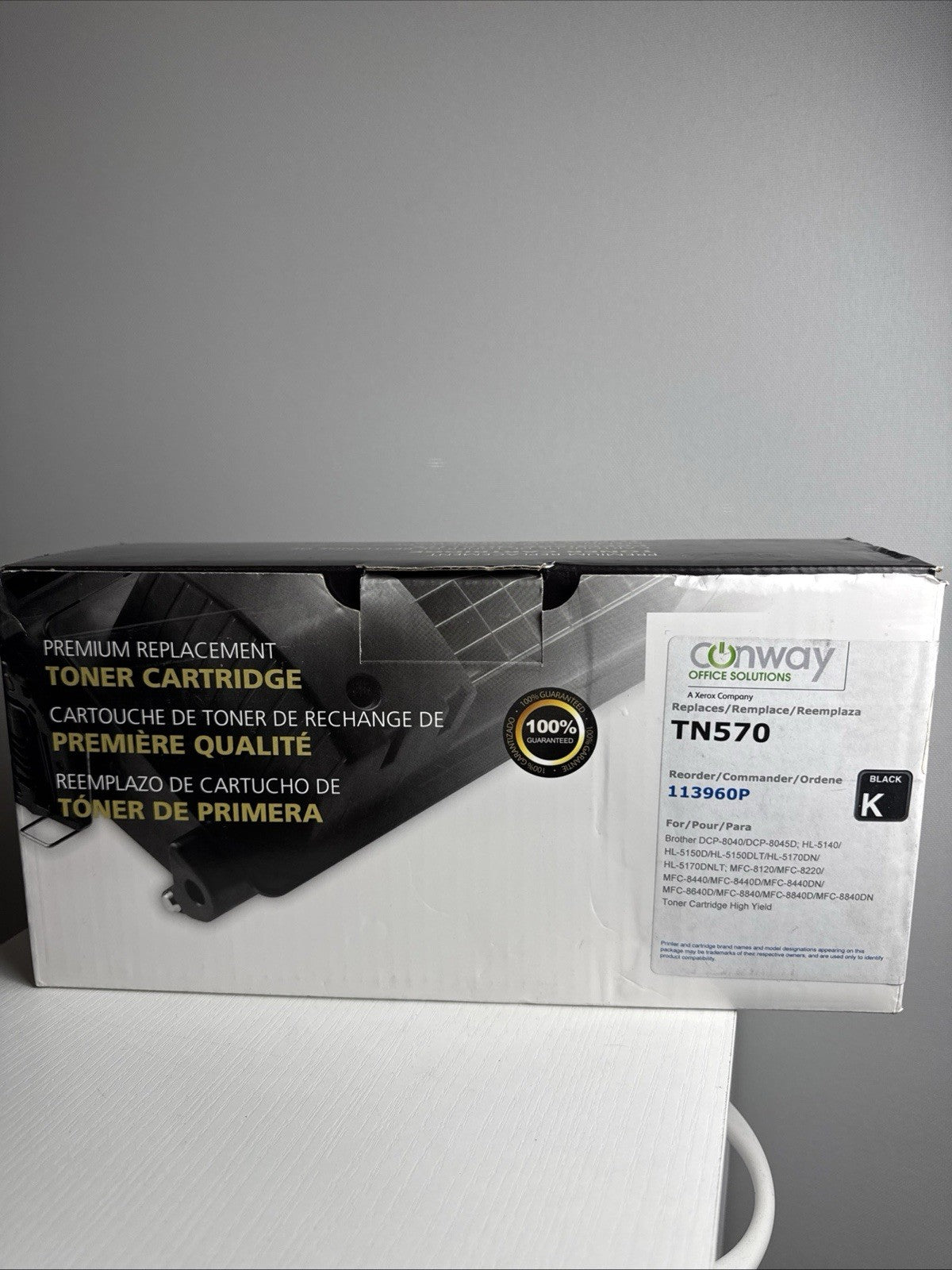 Generic replacement TN-570 black laser toner cartridge sealed in protective packaging.
