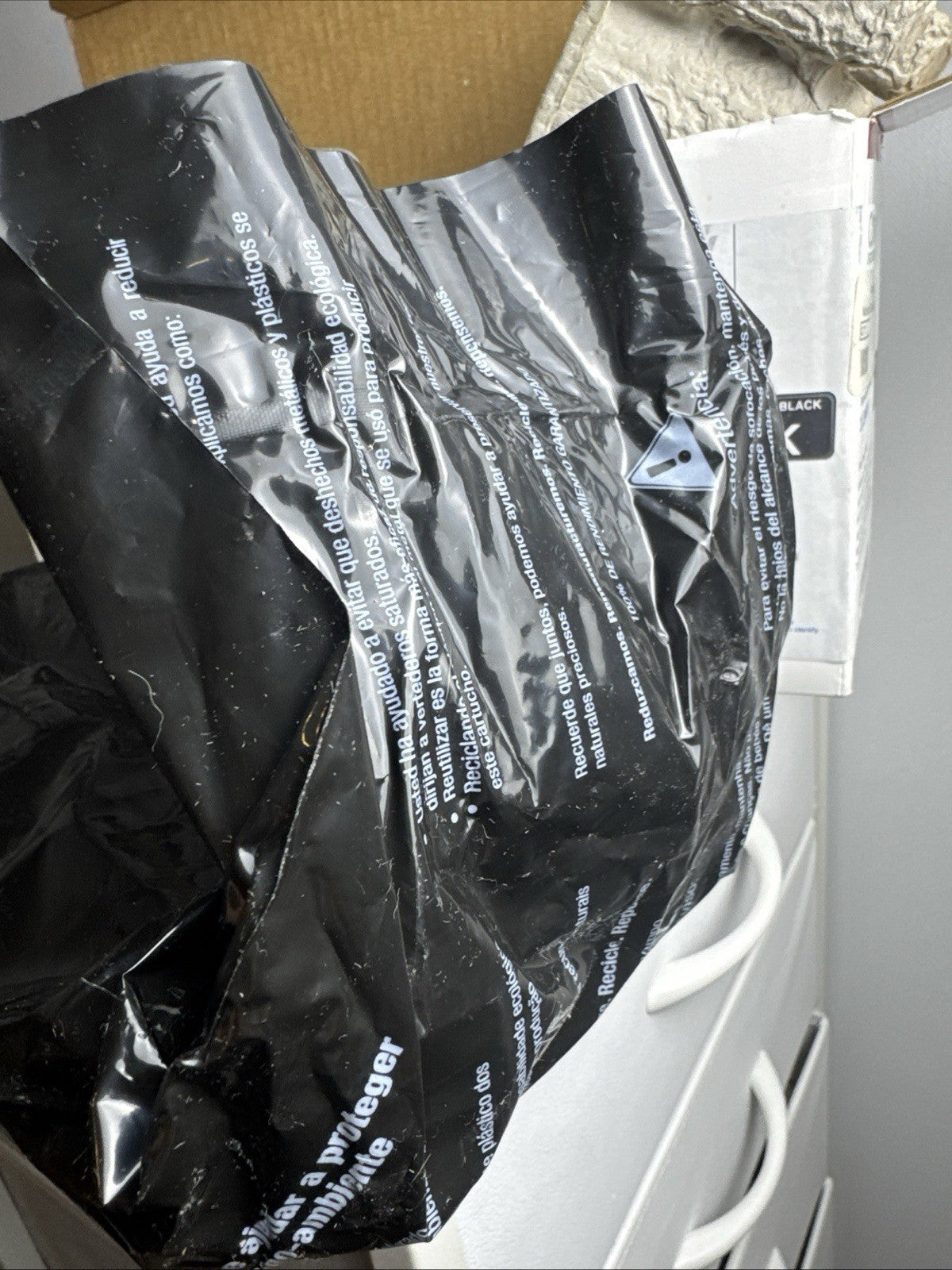 Generic replacement TN-570 black laser toner cartridge sealed in protective packaging.
