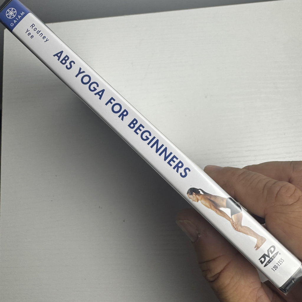 Front cover of Gaiam's Abs Yoga for Beginners DVD with Rodney Yee, brand new in original factory shrink wrap.