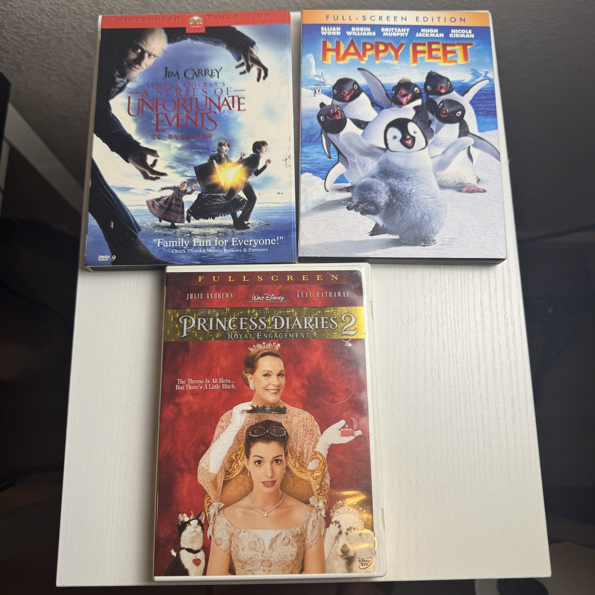 3-DVD family movie set including Happy Feet, The Princess Diaries 2, and Lemony Snicket's A Series of Unfortunate Events.