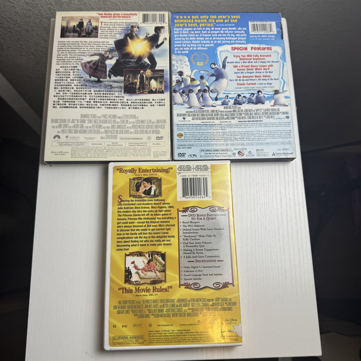3-DVD family movie set including Happy Feet, The Princess Diaries 2, and Lemony Snicket's A Series of Unfortunate Events.