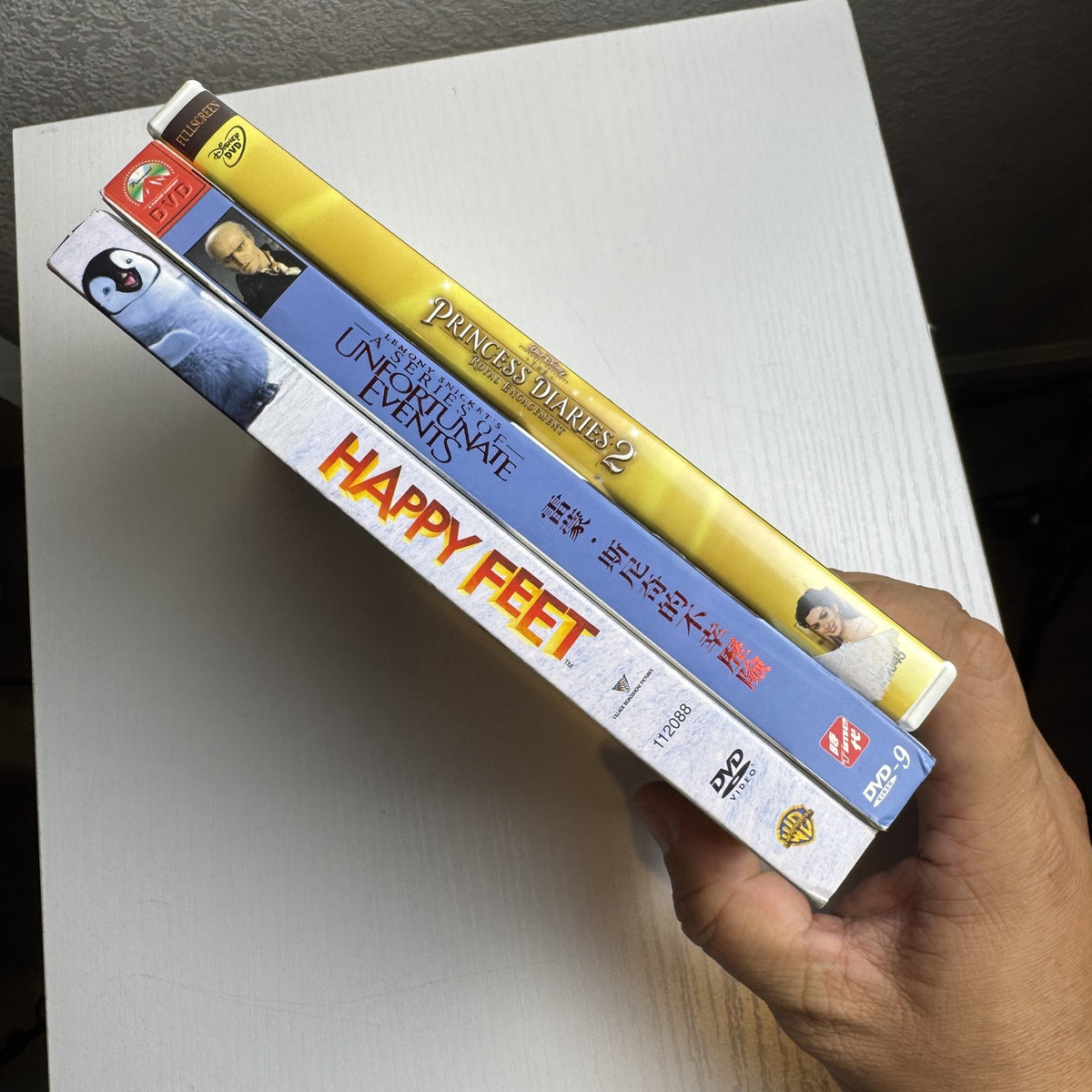 3-DVD family movie set including Happy Feet, The Princess Diaries 2, and Lemony Snicket's A Series of Unfortunate Events.