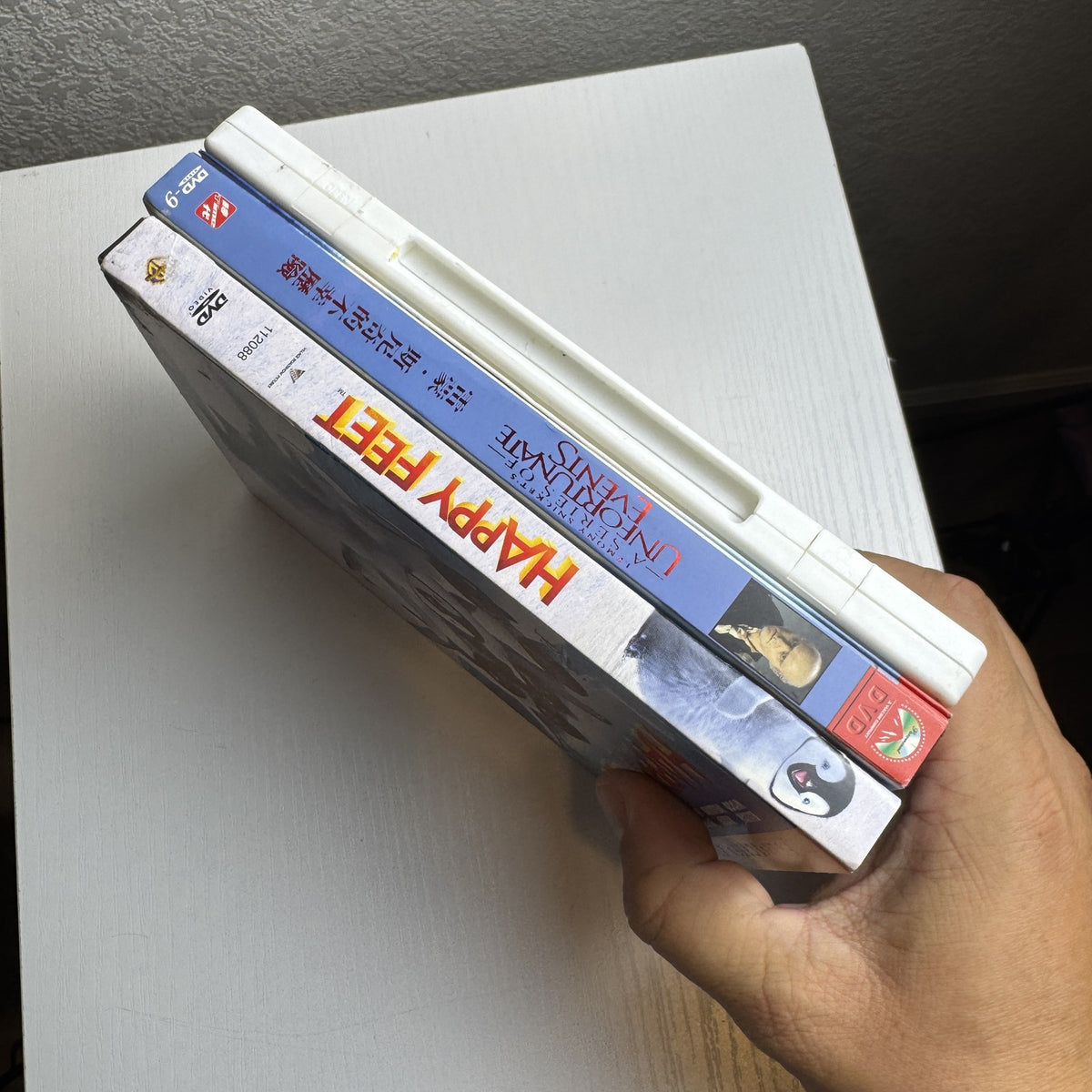 3-DVD family movie set including Happy Feet, The Princess Diaries 2, and Lemony Snicket's A Series of Unfortunate Events.