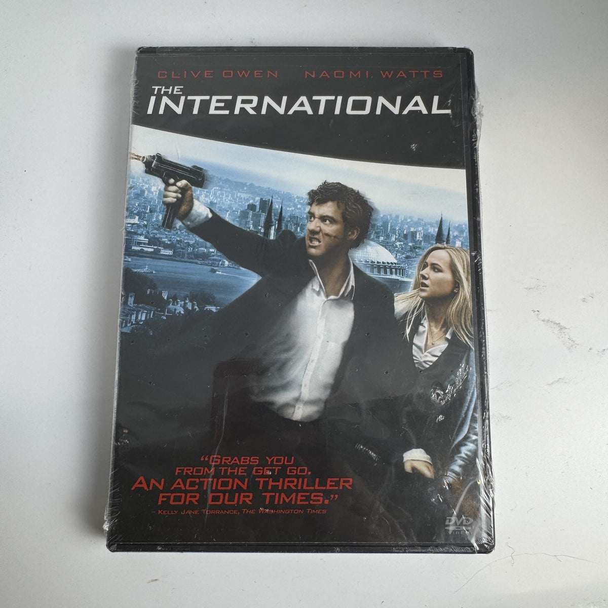 Factory sealed DVD case for the 2009 action thriller movie The International starring Clive Owen and Naomi Watts.
