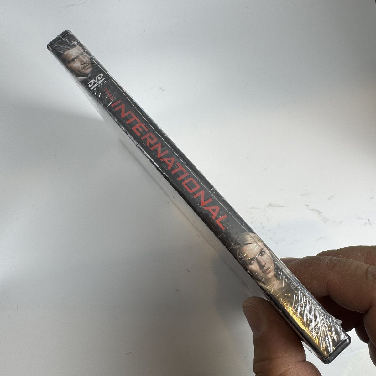 Factory sealed DVD case for the 2009 action thriller movie The International starring Clive Owen and Naomi Watts.