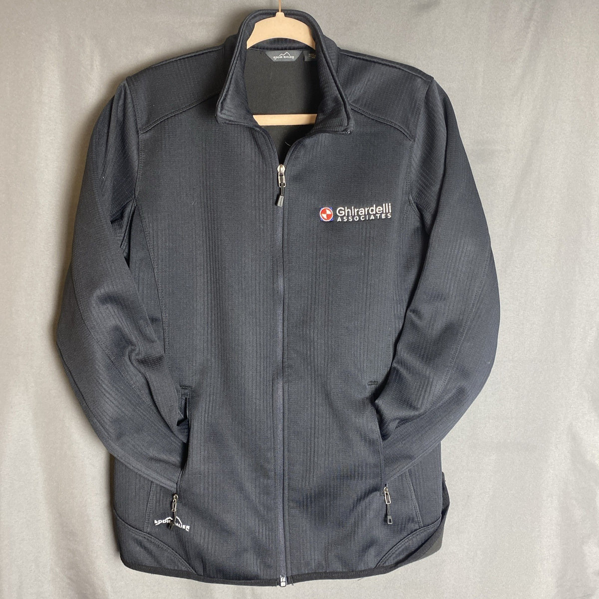 Eddie Bauer women's regular XL full-zip black polyester fleece jacket with front zipper pockets.