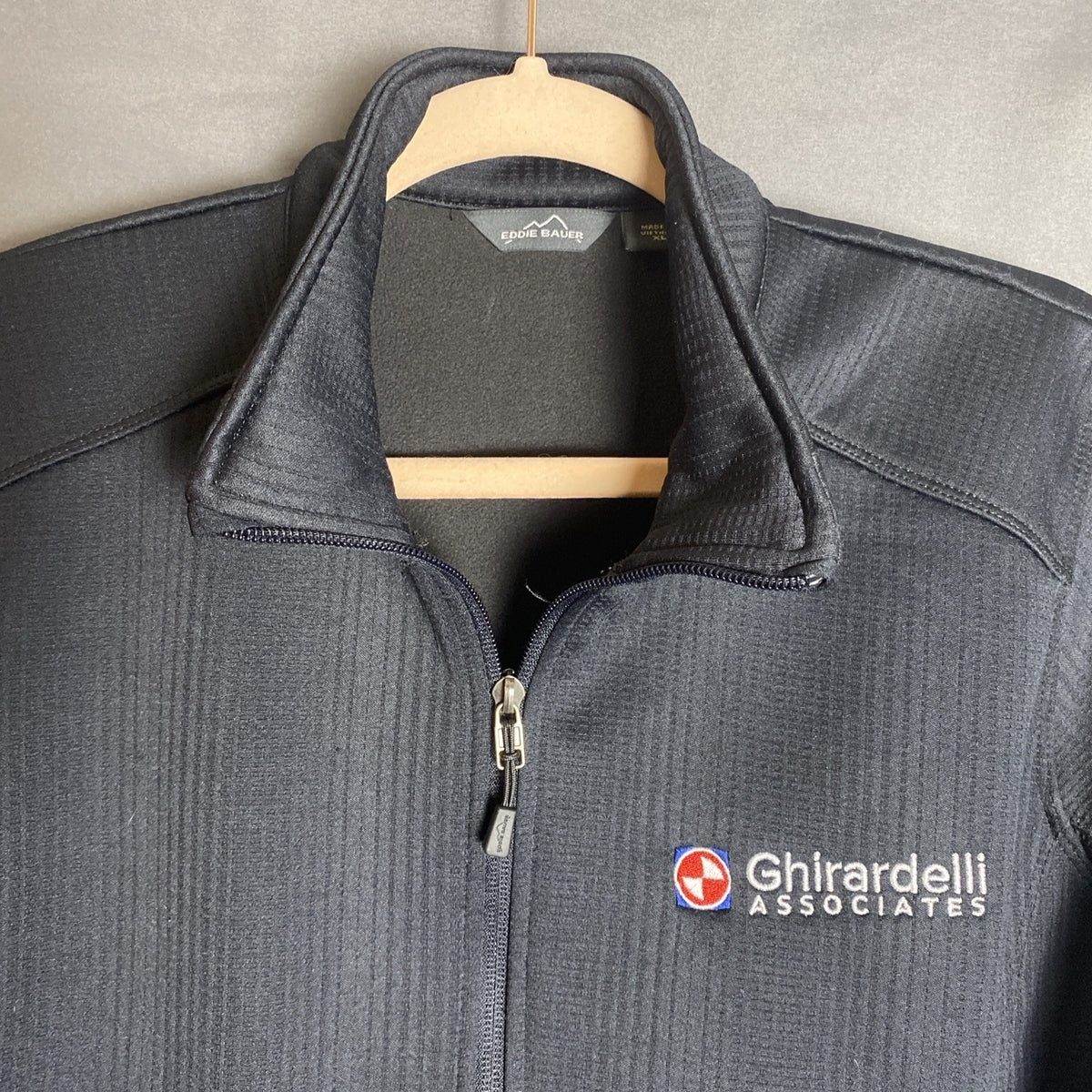 Eddie Bauer women's regular XL full-zip black polyester fleece jacket with front zipper pockets.