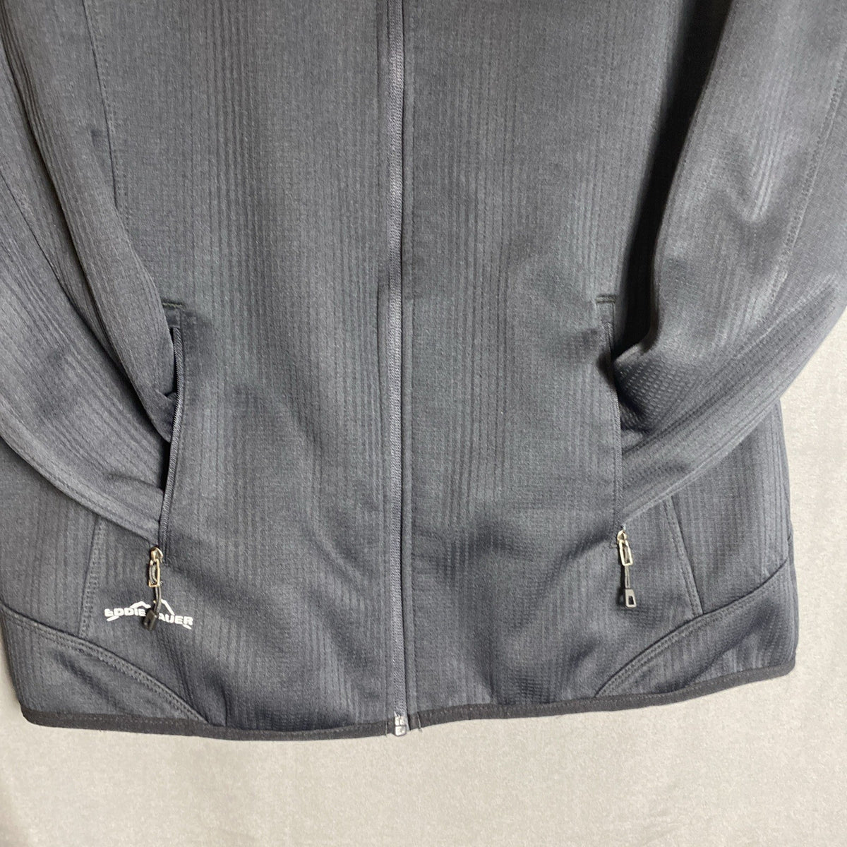 Eddie Bauer women's regular XL full-zip black polyester fleece jacket with front zipper pockets.