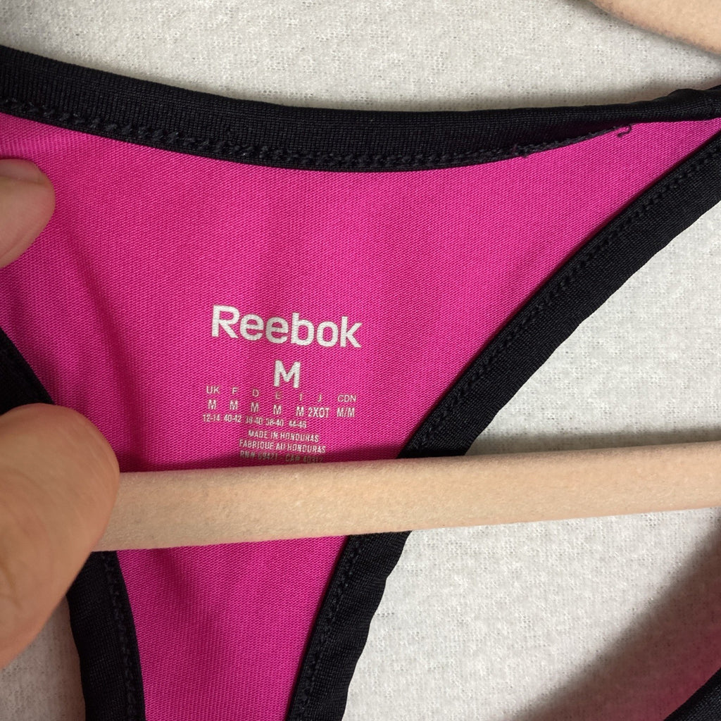 Reebok women's pink and black PlayDry racerback tank top with breast cancer ribbon graphic in size Medium.