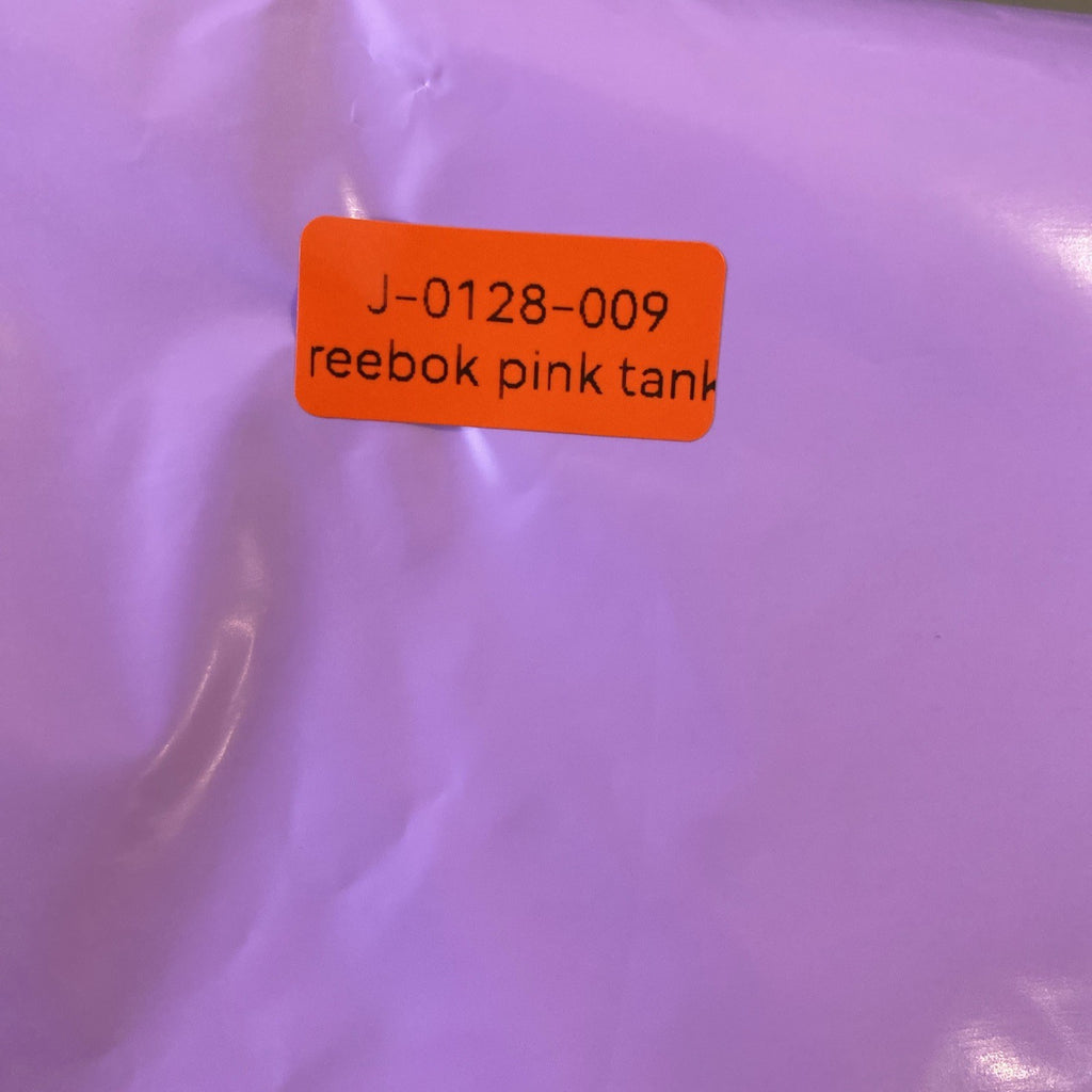Reebok women's pink and black PlayDry racerback tank top with breast cancer ribbon graphic in size Medium.