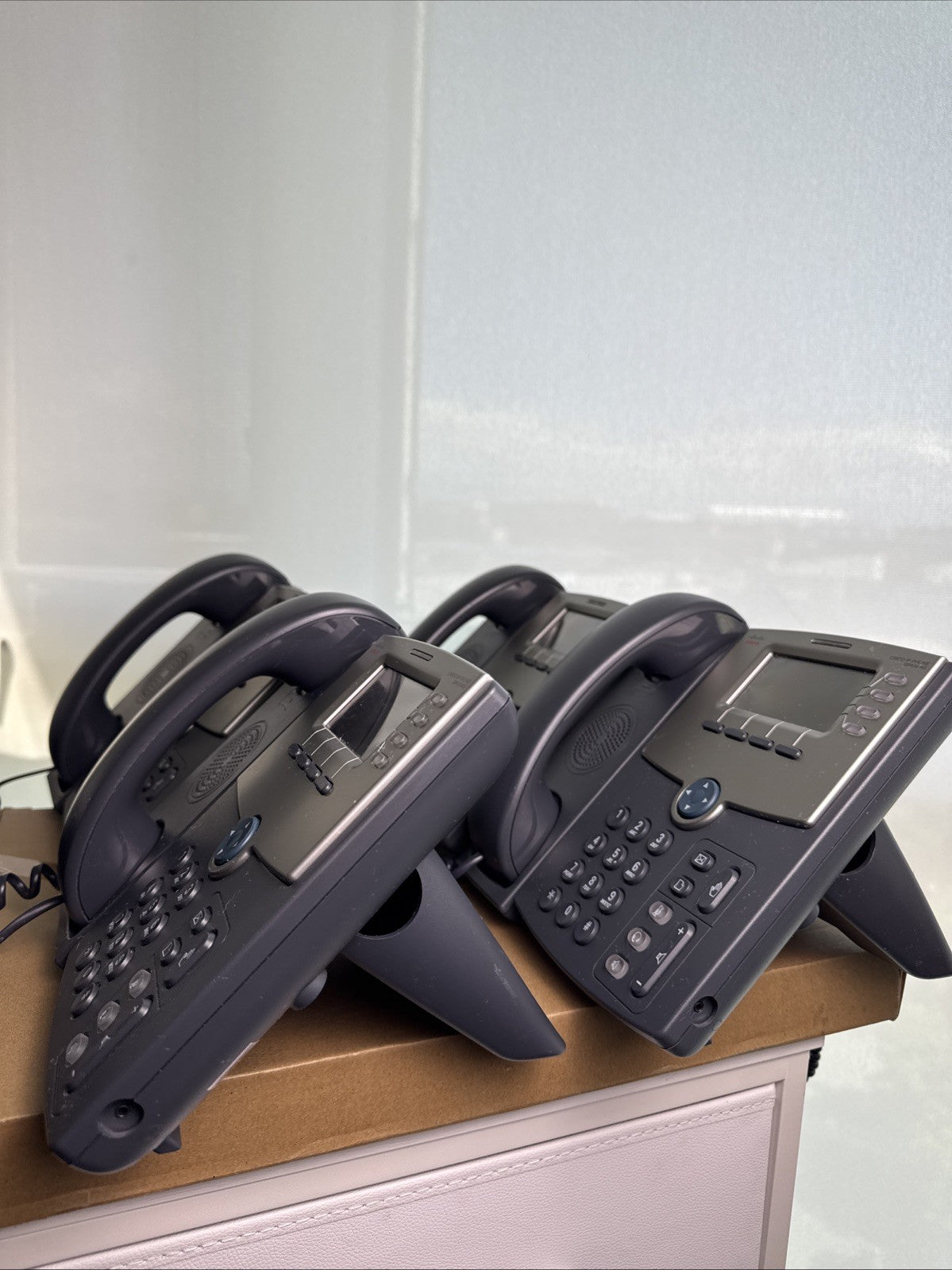 Lot of 4 unlocked Cisco SPA504G 4-line IP phones with handsets and desktop stands
