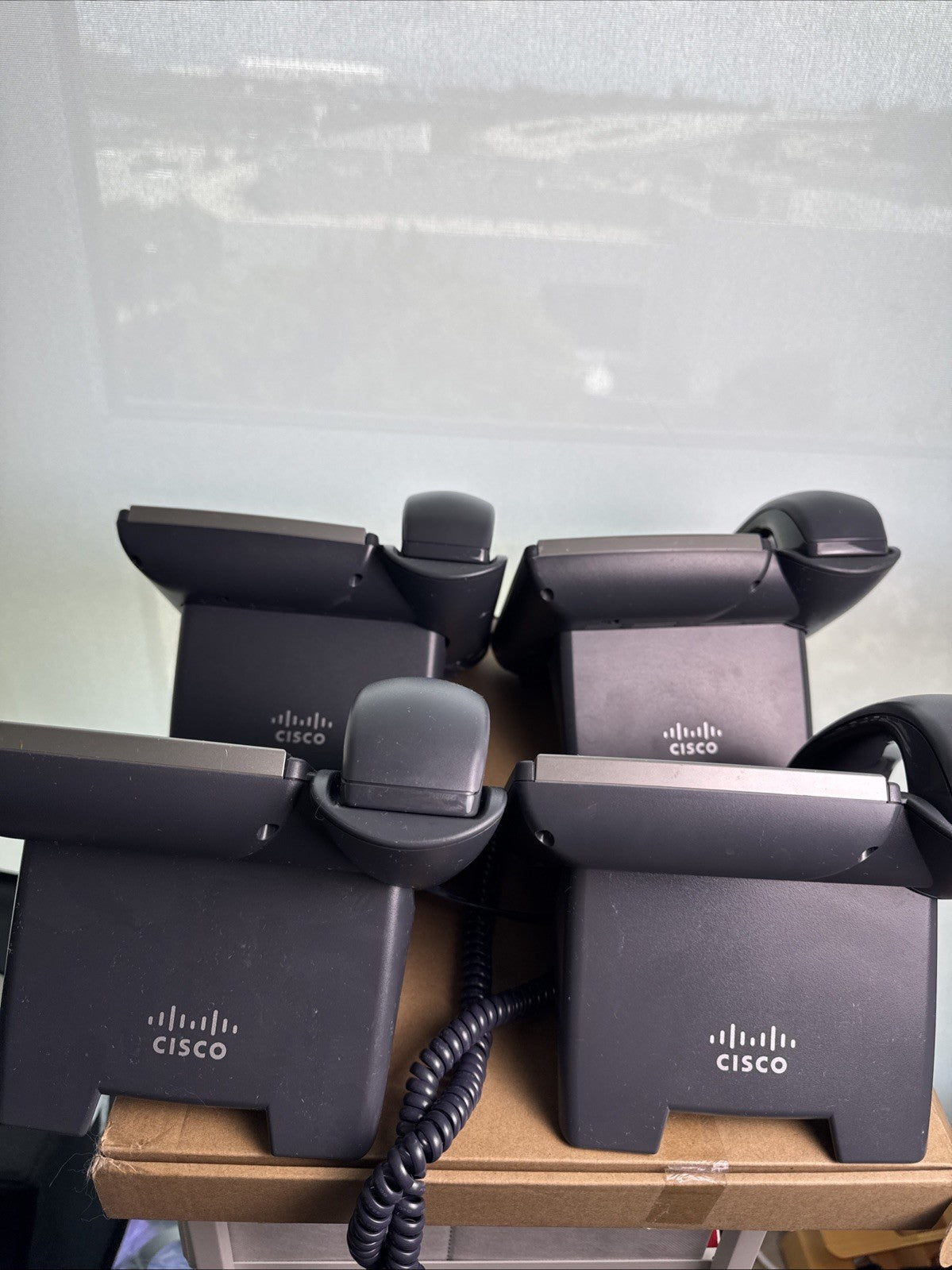 Lot of 4 unlocked Cisco SPA504G 4-line IP phones with handsets and desktop stands