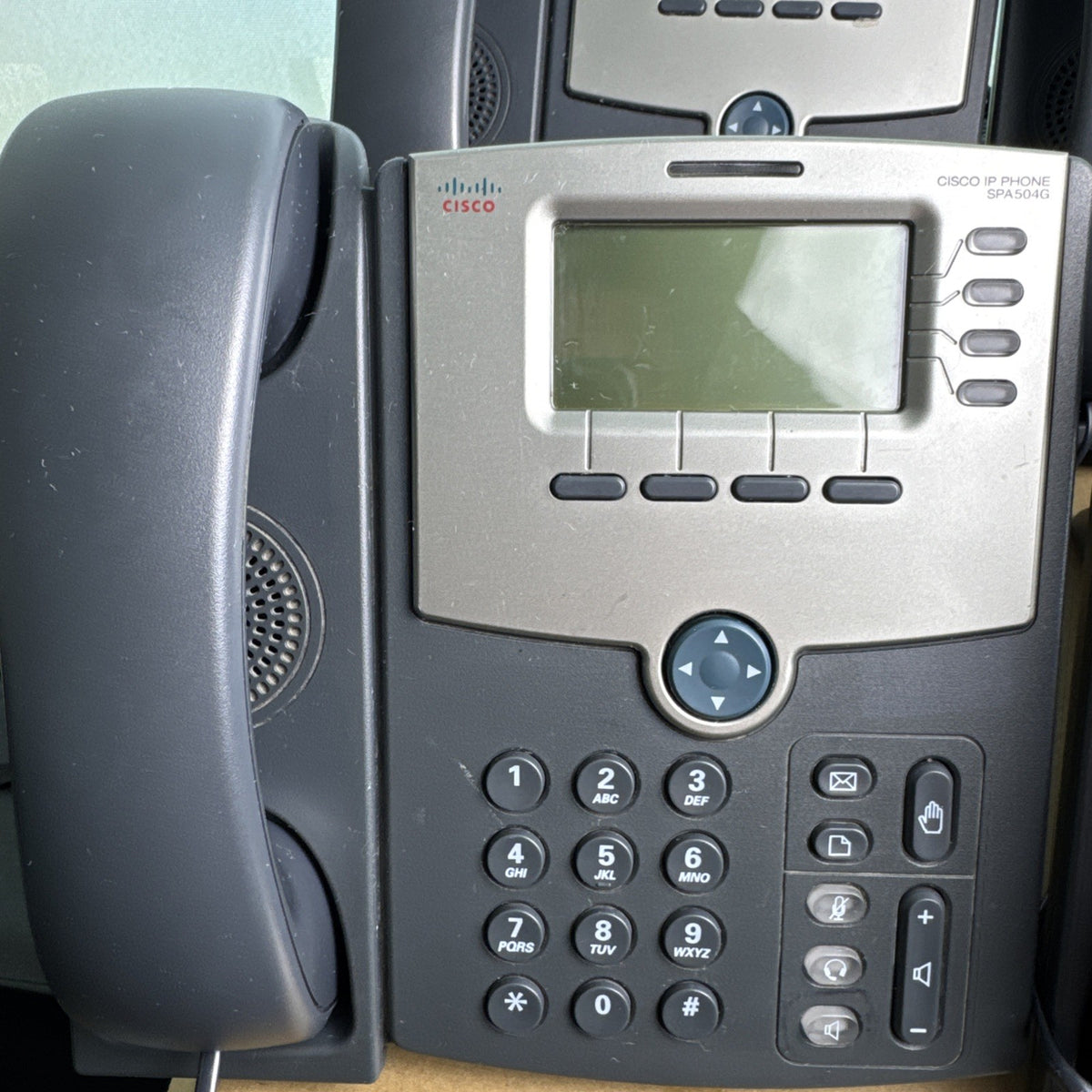 Lot of 4 unlocked Cisco SPA504G 4-line IP phones with handsets and desktop stands