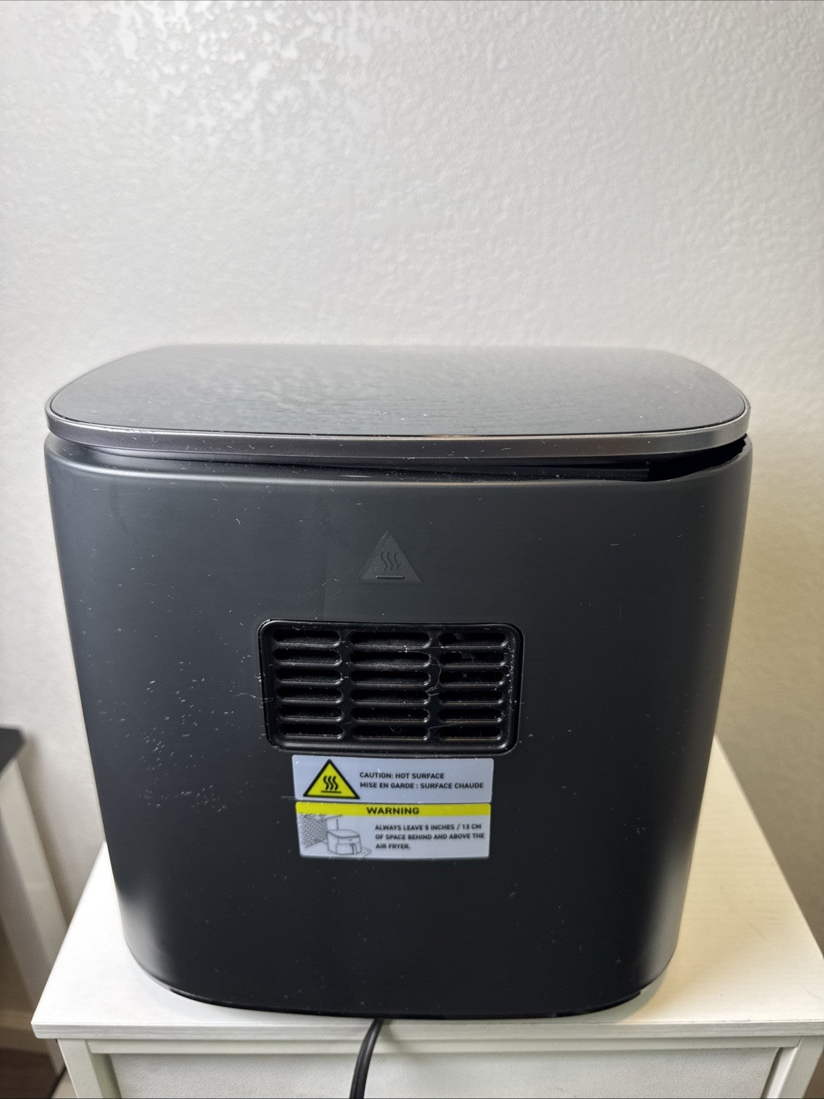 Black Cosori TurboBlaze 6-quart air fryer showing top control panel and front basket