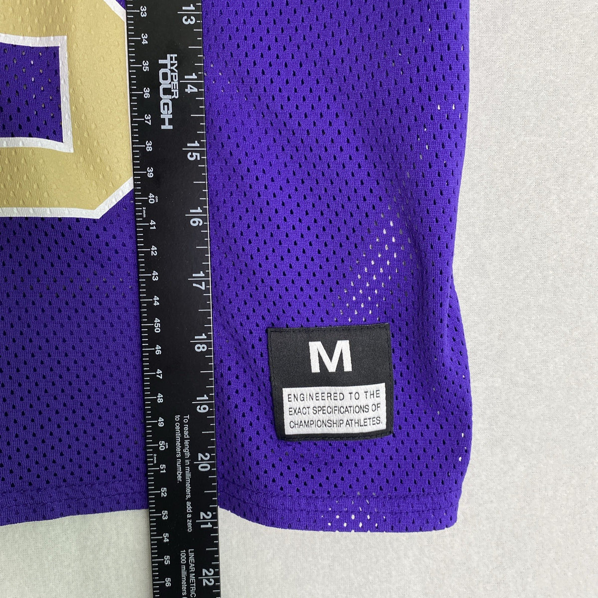 Front and back of purple Nike Dri-FIT Washington Huskies mesh jersey shirt in women's size medium with Keates 15 graphics.