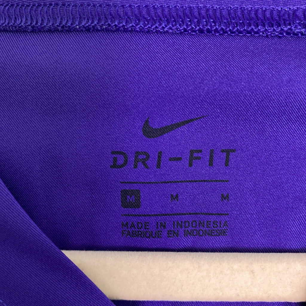 Front and back of purple Nike Dri-FIT Washington Huskies mesh jersey shirt in women's size medium with Keates 15 graphics.